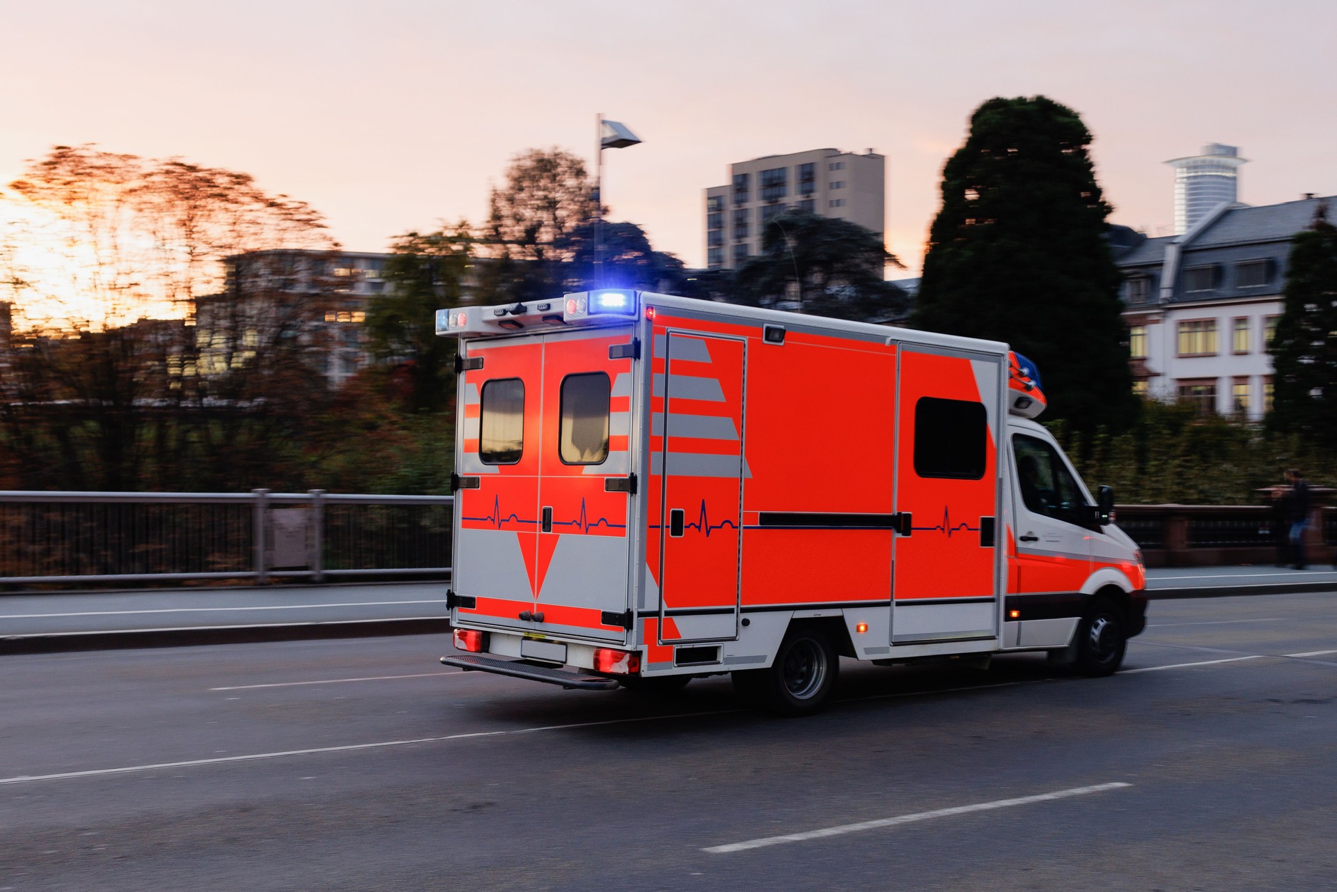 Ambulance truck rushing over the bridge in Frankfurt am Main